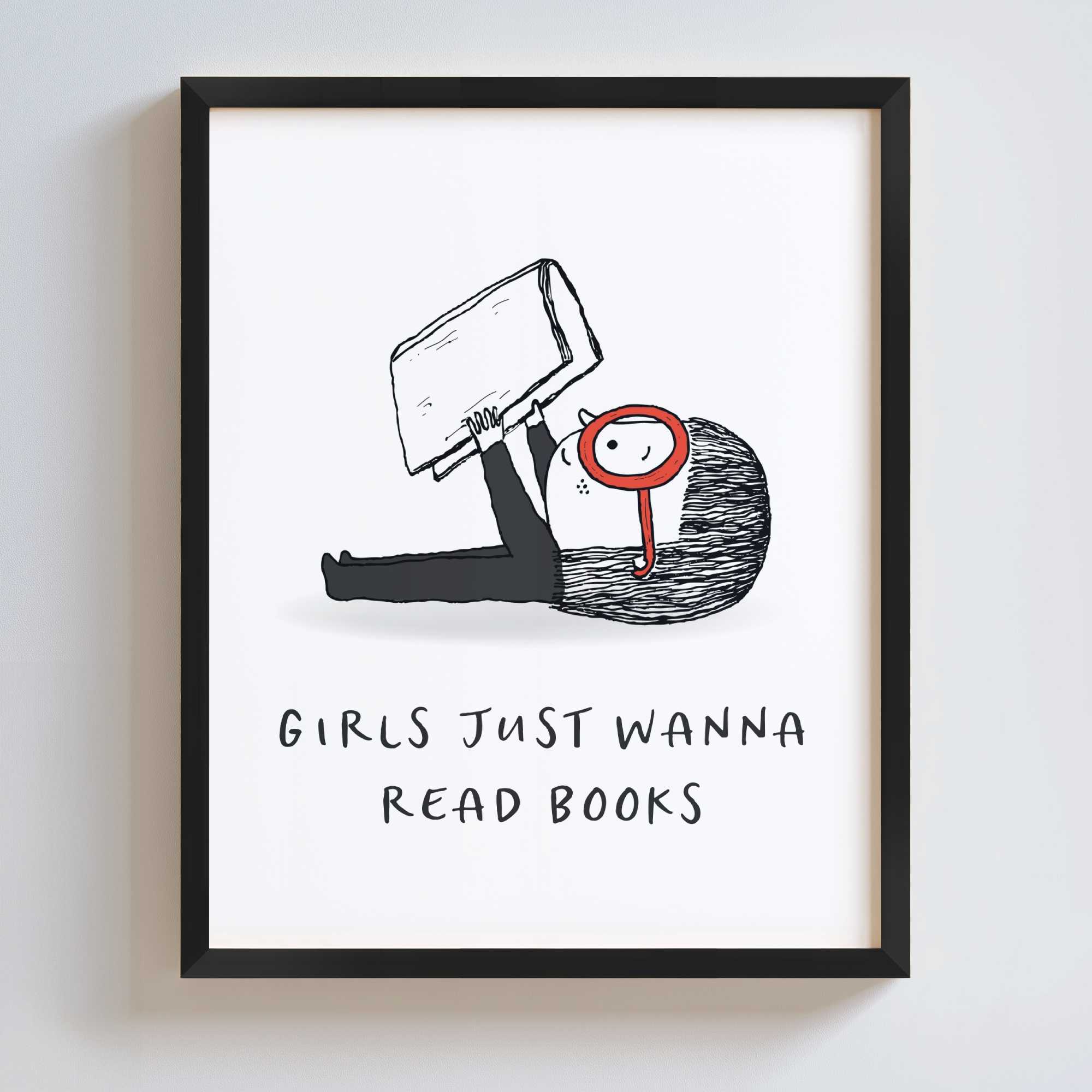 Framed artwork with a black and white illustration of a girl holding a book and text 'Girls just wanna read books' on a white background.