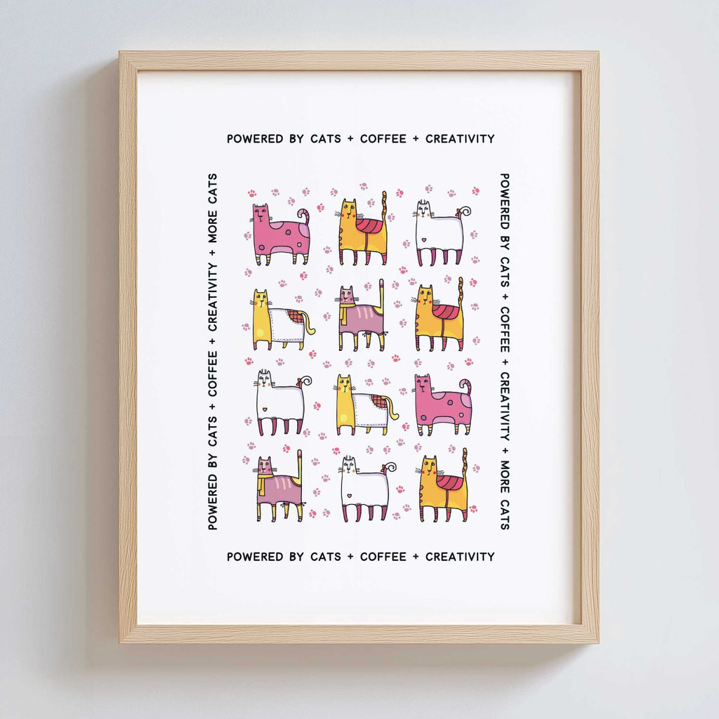 Framed print with colorful cat illustrations and text on a white background