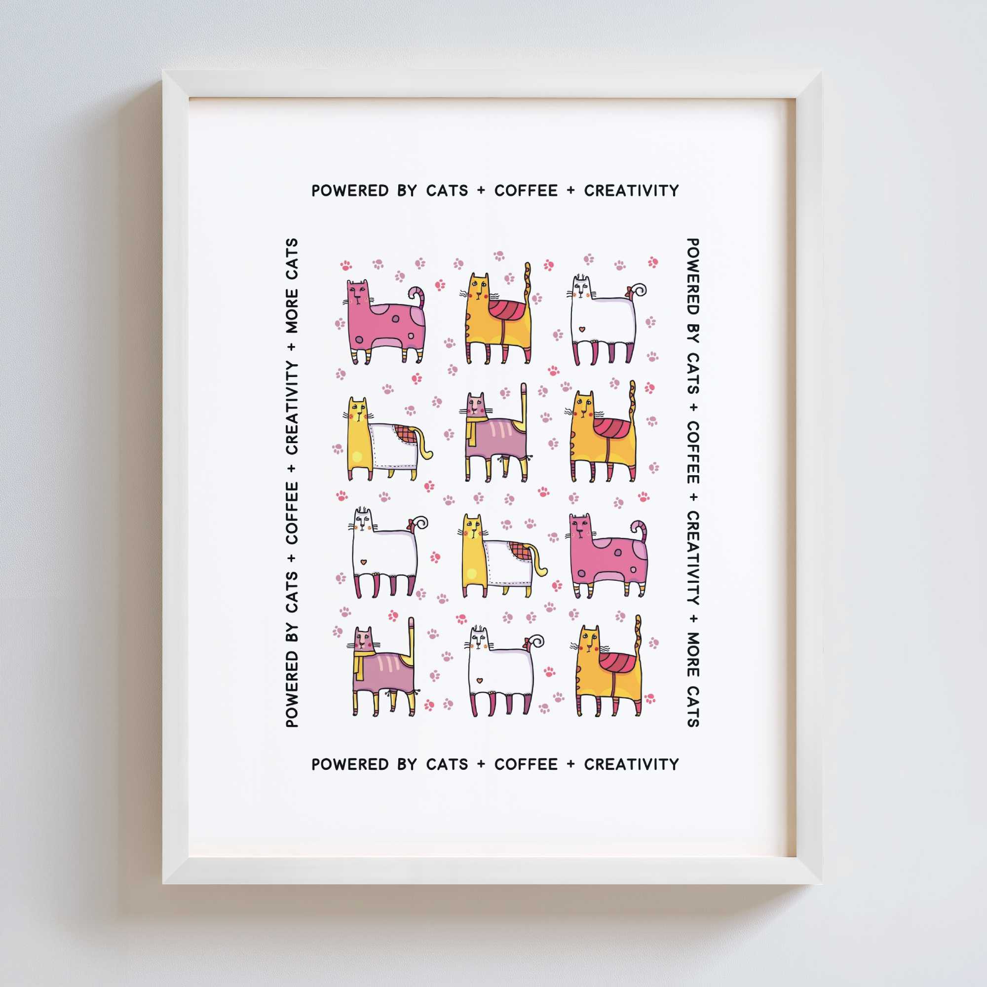 Framed print with cartoon cats and text on a white background