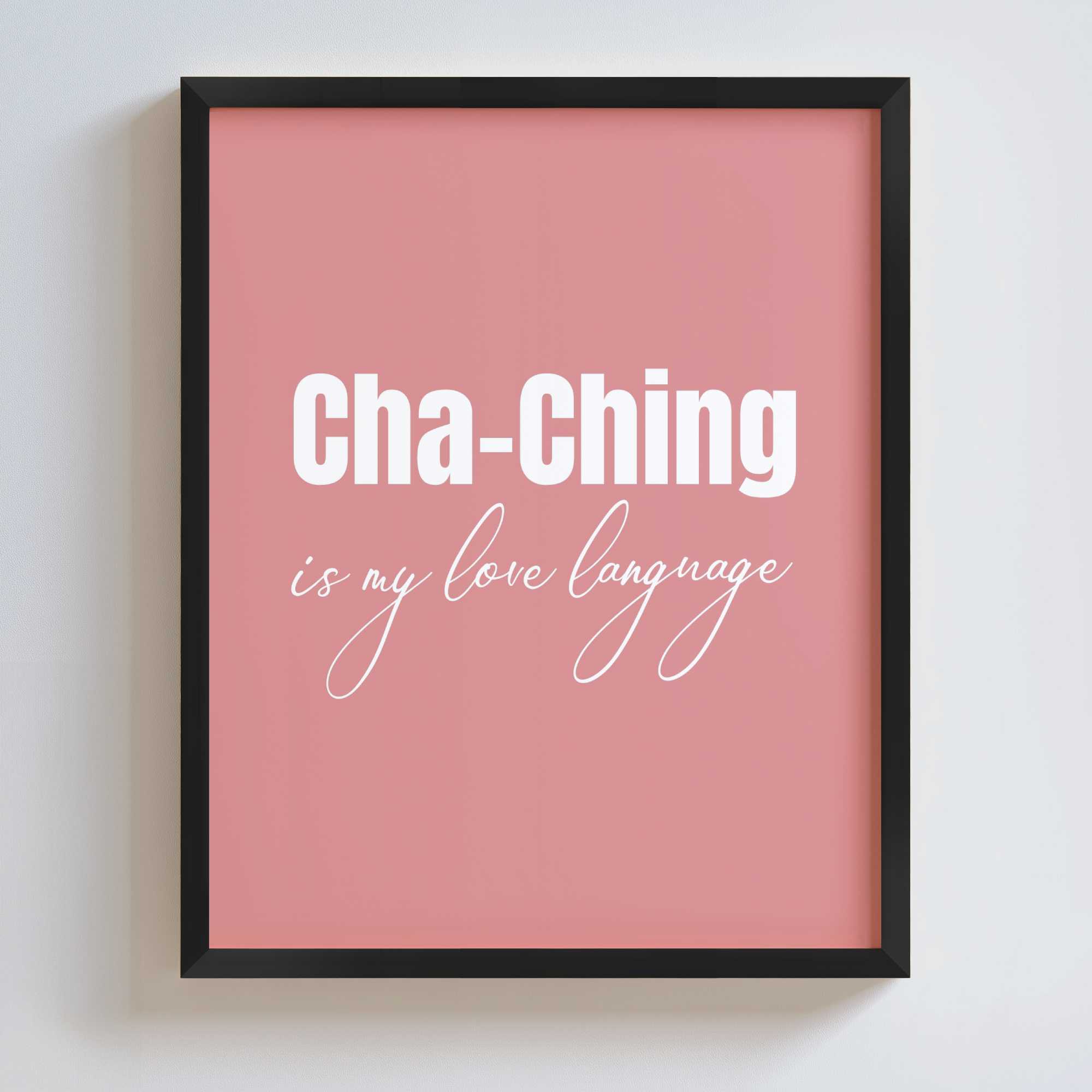 Framed pink poster with 'Cha-Ching is my love language' text on a white wall.