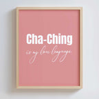 Framed pink poster in an oak frame with 'Cha-Ching is my love language' text on a white background