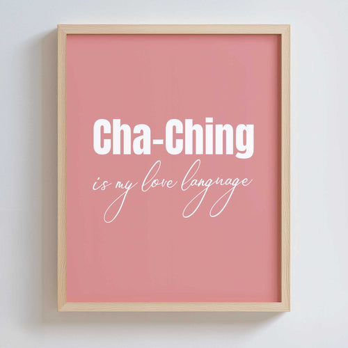 Framed pink poster in an oak frame with 'Cha-Ching is my love language' text on a white background