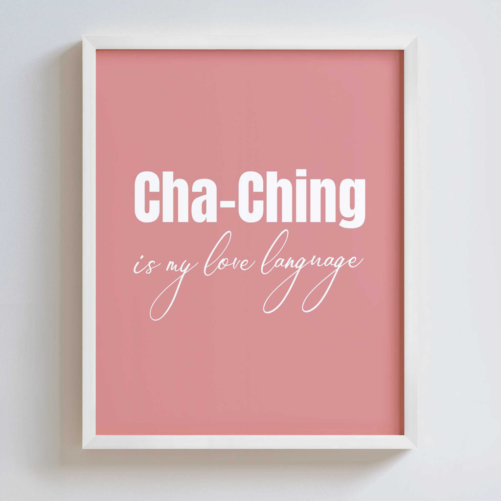 Framed pink poster in a white frame with 'Cha-Ching is my love language' text on a white background