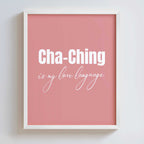 Framed pink poster in a white frame with 'Cha-Ching is my love language' text on a white background