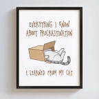 Framed print with a cat in a box and humorous text on a white background