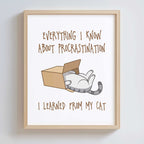 Wood-framed print with a cat illustration and humorous text on a white wall.