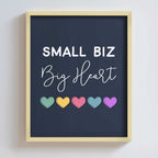 Framed poster with 'Small Biz Big Heart' text and colorful hearts on a dark background
